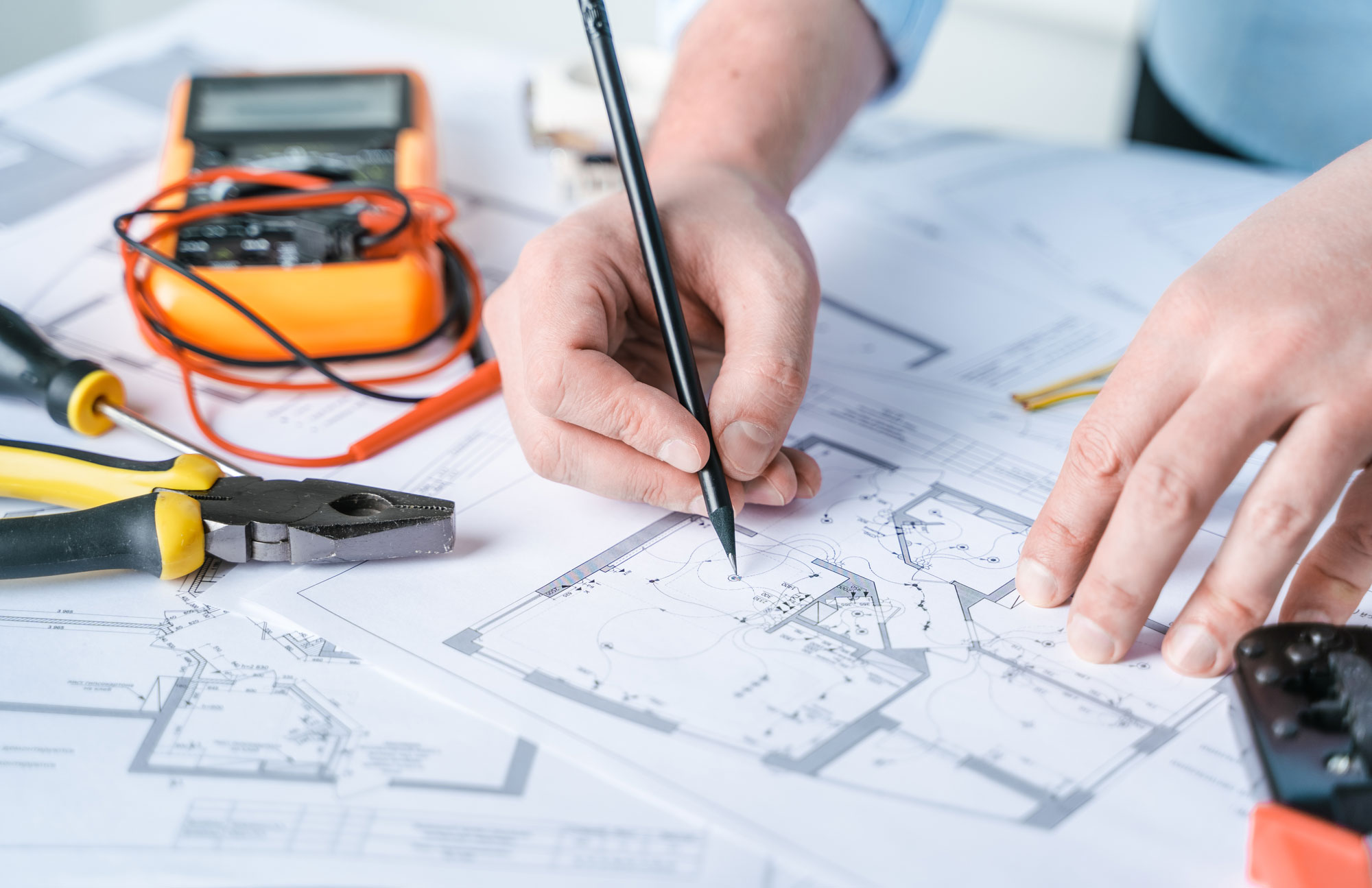 Electrician reviewing electrical panel plans