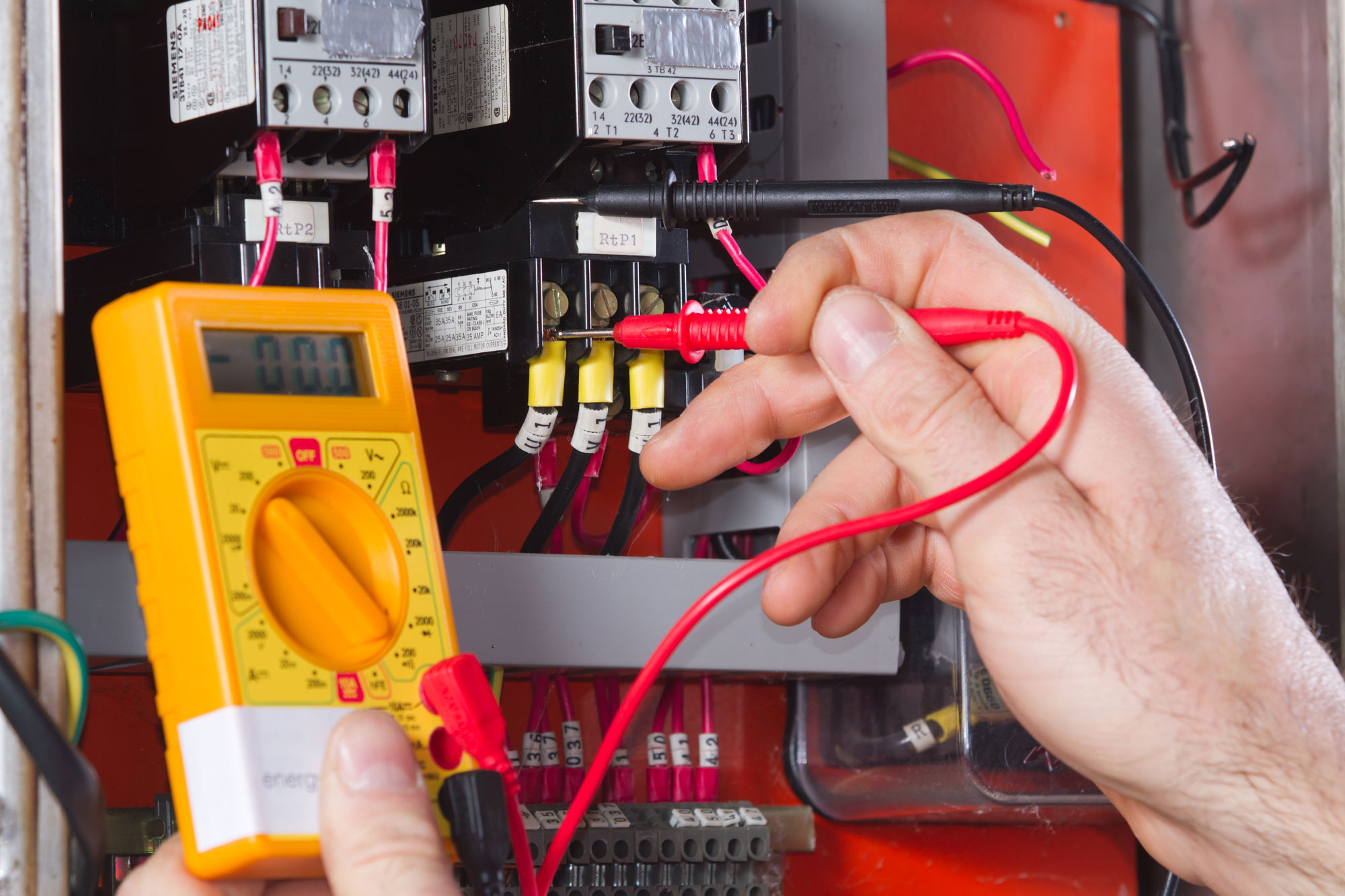 Electrician diagnosing an electrical problem